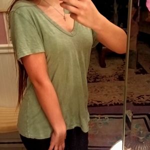 A green V neck shirt